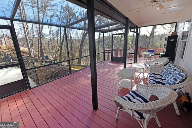 deck featuring a lanai and ceiling fan