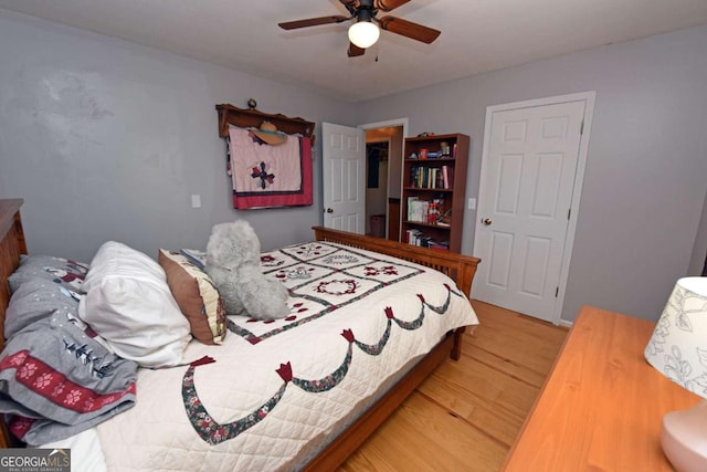 bedroom featuring ceiling fan and wood finished floors