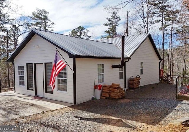 106 Opaque Way, Ellijay, GA 30540 - view of side of property with a metal roof and a patio