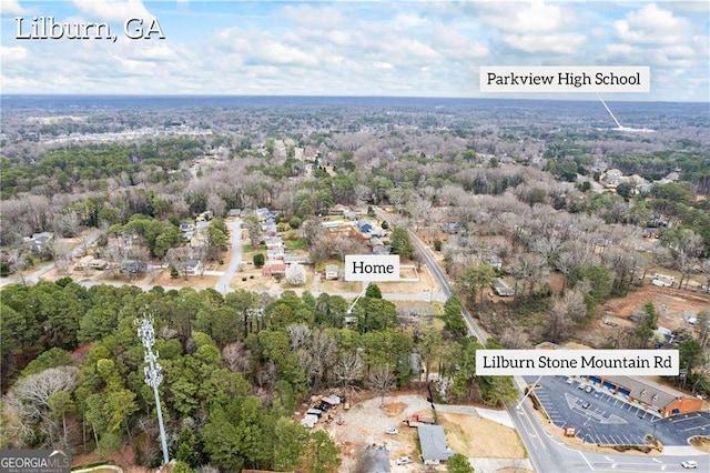 drone / aerial view featuring a view of trees