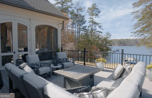 view of patio / terrace with outdoor lounge area and a water view