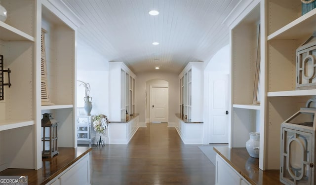 hall with dark wood-style floors, recessed lighting, arched walkways, and wood ceiling
