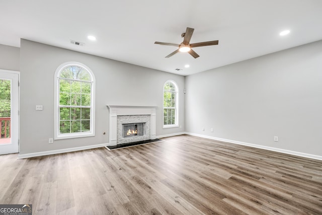 unfurnished living room with recessed lighting, visible vents, and wood finished floors