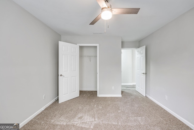 unfurnished bedroom featuring visible vents, baseboards, carpet, and a closet