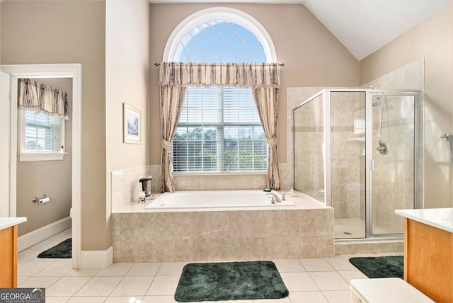 bathroom with tile patterned floors, a shower stall, a bath, and vanity