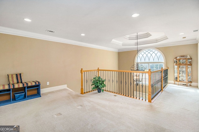 interior space with visible vents, carpet floors, recessed lighting, ornamental molding, and a raised ceiling