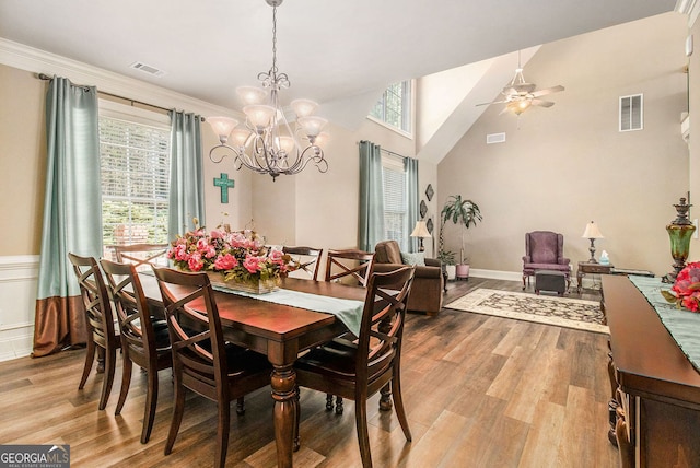 dining room featuring light wood-type flooring, visible vents, and a healthy amount of sunlight