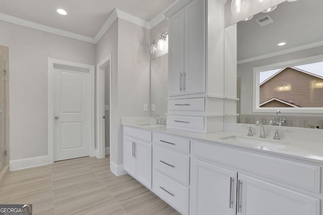 full bathroom with visible vents, ornamental molding, and a sink