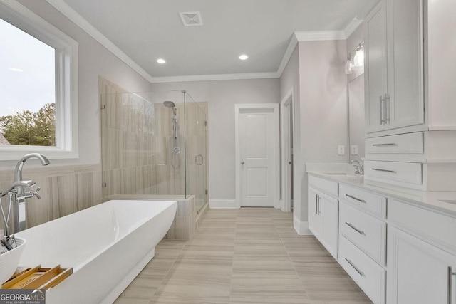 full bath with visible vents, ornamental molding, a stall shower, a soaking tub, and vanity