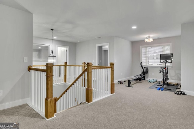 workout area featuring recessed lighting, baseboards, and carpet