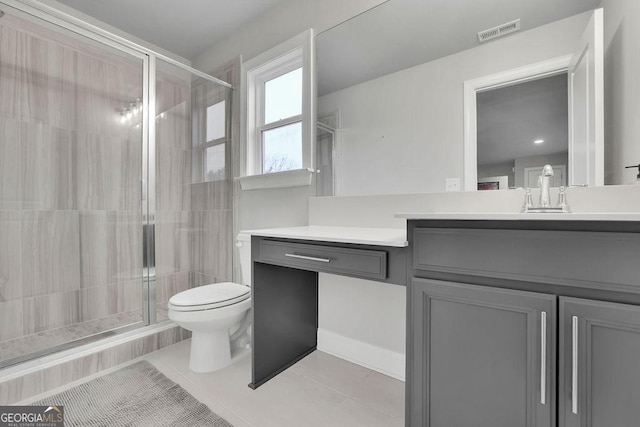 full bathroom featuring visible vents, a shower stall, toilet, and vanity