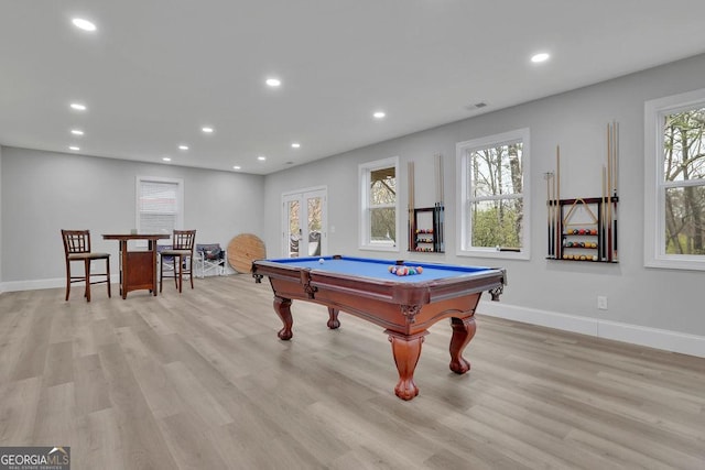 recreation room with recessed lighting, plenty of natural light, and light wood-style floors