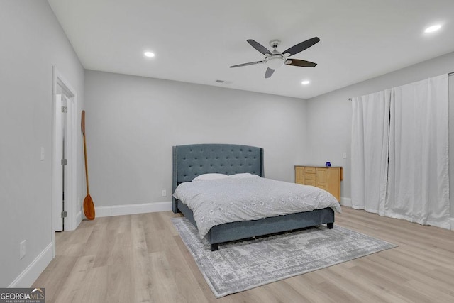 bedroom featuring recessed lighting, light wood-style floors, and baseboards