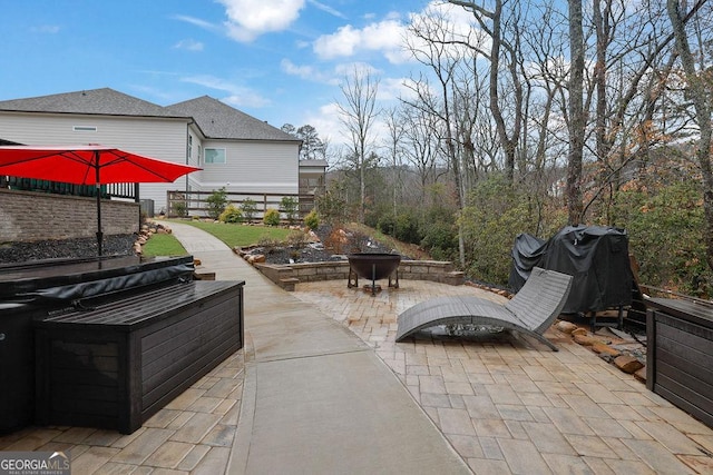 view of patio / terrace featuring area for grilling and an outdoor fire pit