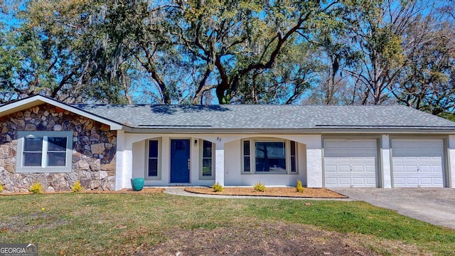 ranch-style house featuring stucco siding, a front lawn, stone siding, concrete driveway, and an attached garage