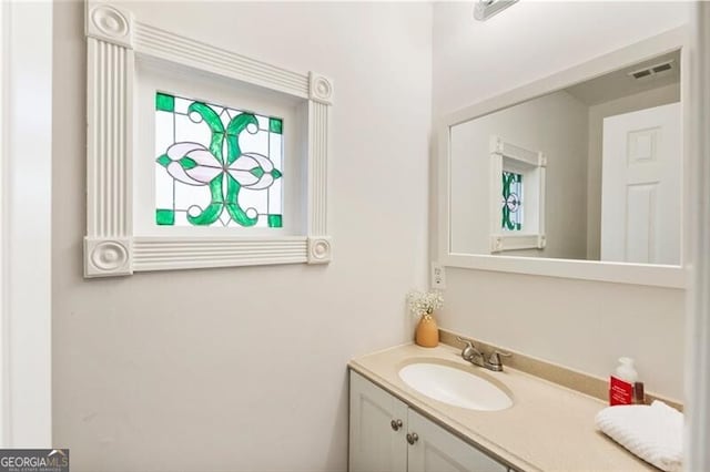 bathroom with visible vents and vanity