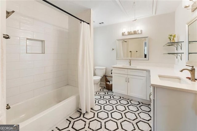 bathroom featuring visible vents, shower / bath combo with shower curtain, toilet, and vanity