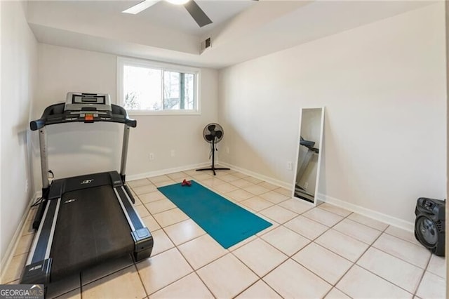 workout room with tile patterned floors, visible vents, baseboards, and ceiling fan