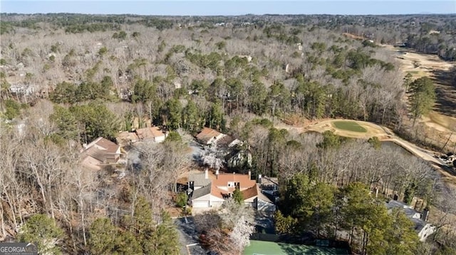 aerial view featuring a wooded view