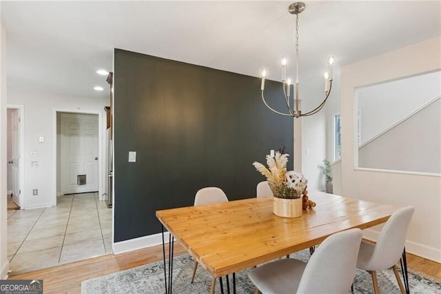 dining room featuring recessed lighting, baseboards, a chandelier, and light wood-type flooring