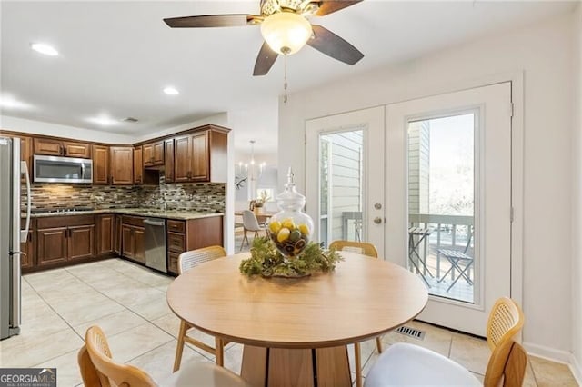 dining room with light tile patterned floors, visible vents, recessed lighting, and french doors