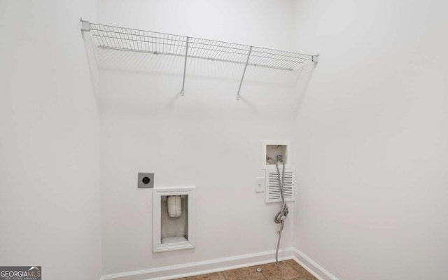 laundry room with hookup for an electric dryer, hookup for a washing machine, laundry area, and baseboards