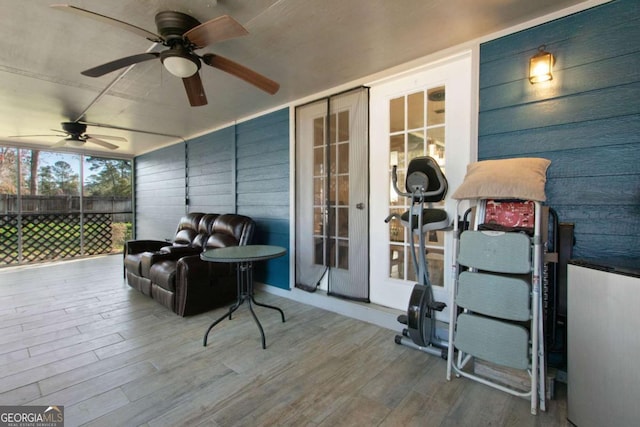 exterior space with ceiling fan and fence