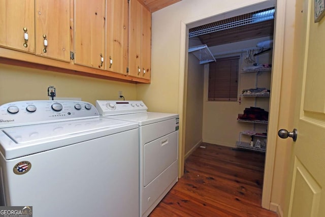 clothes washing area with washer and dryer, dark wood-type flooring, cabinet space, and baseboards