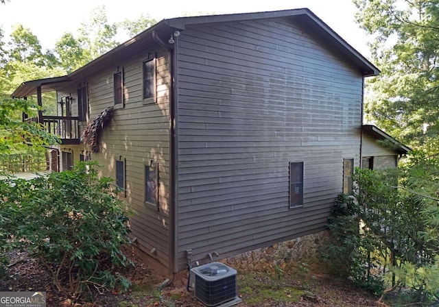 view of property exterior with central AC