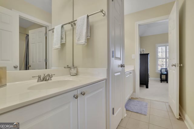 full bath with tile patterned floors, baseboards, and vanity