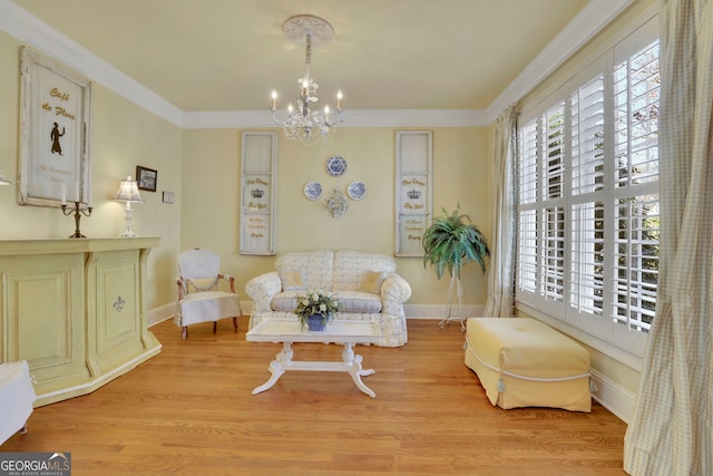 sitting room featuring crown molding, a healthy amount of sunlight, and a chandelier