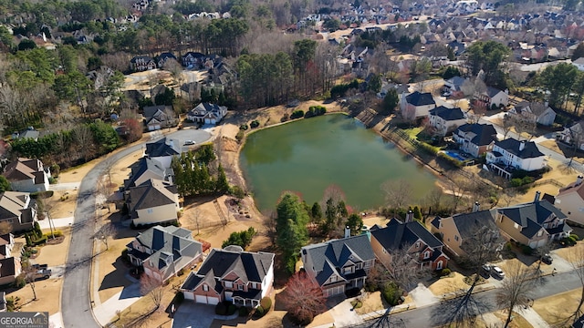 birds eye view of property featuring a residential view and a water view