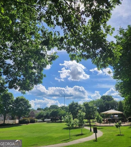 view of community featuring a lawn