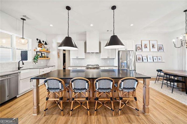 847 Cumberland Ave, Dallas, GA 30157 - kitchen with white cabinets, appliances with stainless steel finishes, custom range hood, and a sink