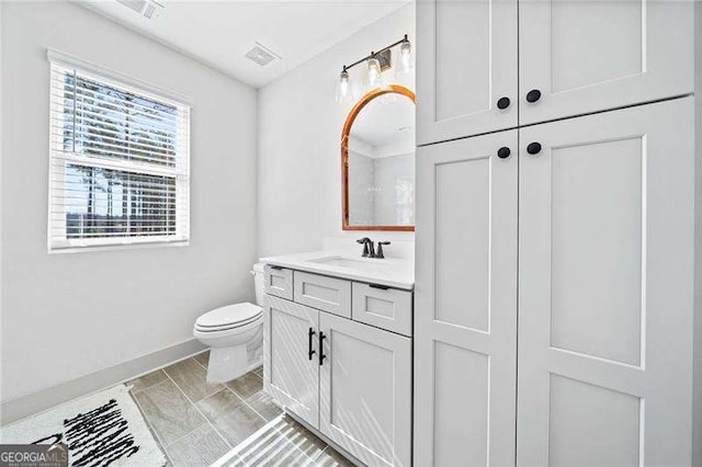 847 Cumberland Ave, Dallas, GA 30157 - bathroom with visible vents, baseboards, toilet, and vanity