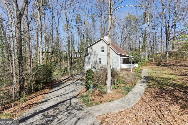 view of side of property with a chimney