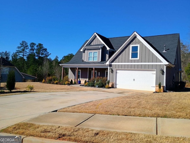 craftsman-style house with concrete driveway, a porch, board and batten siding, and an attached garage