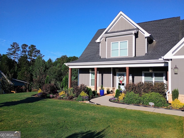 336 White Oak Way, Monroe, GA 30655 - view of front of house featuring board and batten siding, a front yard, and roof with shingles