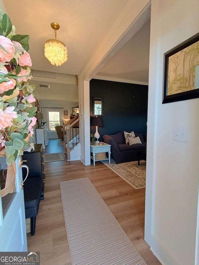 336 White Oak Way, Monroe, GA 30655 - entryway with light wood-type flooring, stairway, and a chandelier