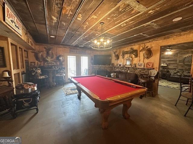 game room with billiards, wood ceiling, and finished concrete floors