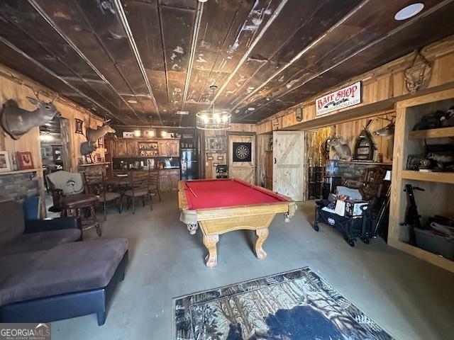 rec room with pool table, wood ceiling, and concrete flooring