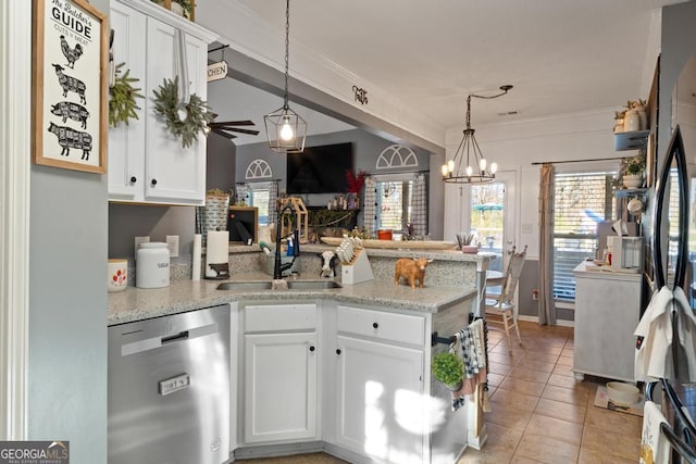 kitchen featuring a sink, open floor plan, a peninsula, white cabinets, and dishwasher