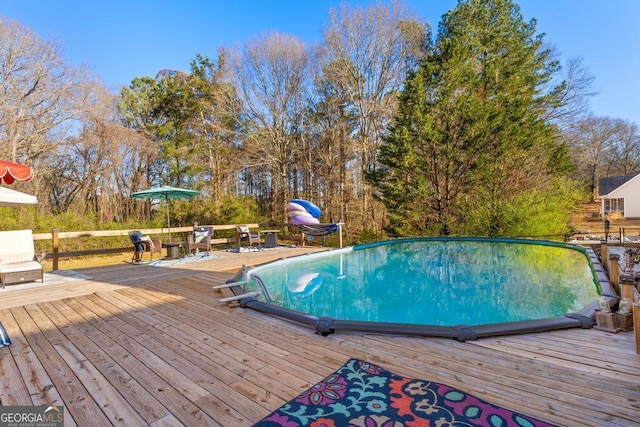 pool with a wooden deck