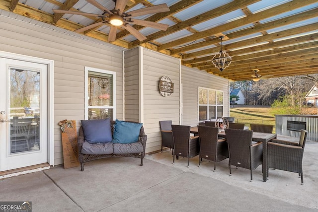 view of patio / terrace featuring outdoor dining space and a ceiling fan