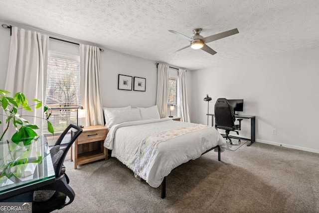 bedroom featuring multiple windows, baseboards, carpet floors, and a textured ceiling