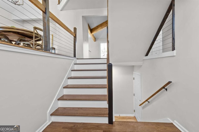 staircase with wood finished floors