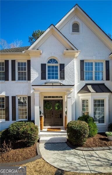 entrance to property with brick siding