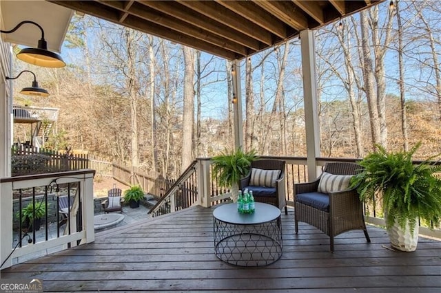 wooden deck featuring fence