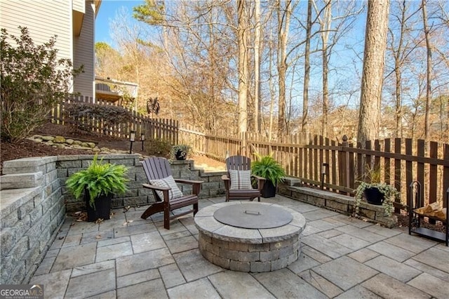 view of patio / terrace with a fenced backyard and an outdoor fire pit