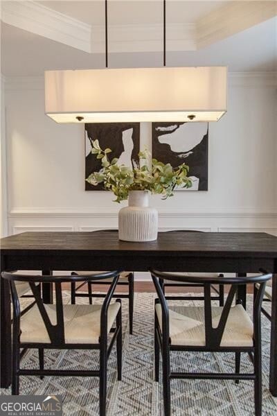 dining room featuring crown molding